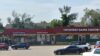 Female grocery store employee robbed, forced to the ground at gunpoint