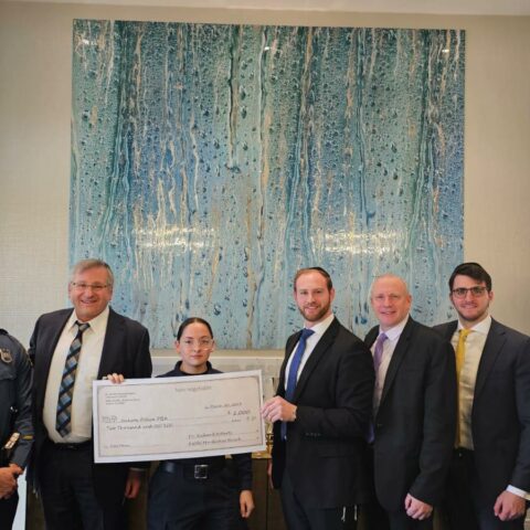 Dr. Roberts, rabbi hirsch meet with jackson police to make generous fundraising donation - photo licensed by shore news network.