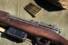 Suspected drug dealer had two m1 rifles and large capacity magazines during traffic stop