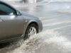 Flood road - car driving through rain. - file photo.