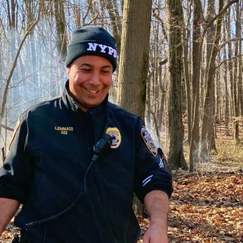 Nyc cop puts out brush fire at staten island high school - photo licensed by shore news network.