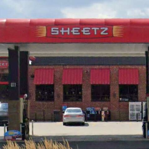 Police arrest man sitting in aisle of sheetz, eating food off shelves - photo licensed by shore news network.