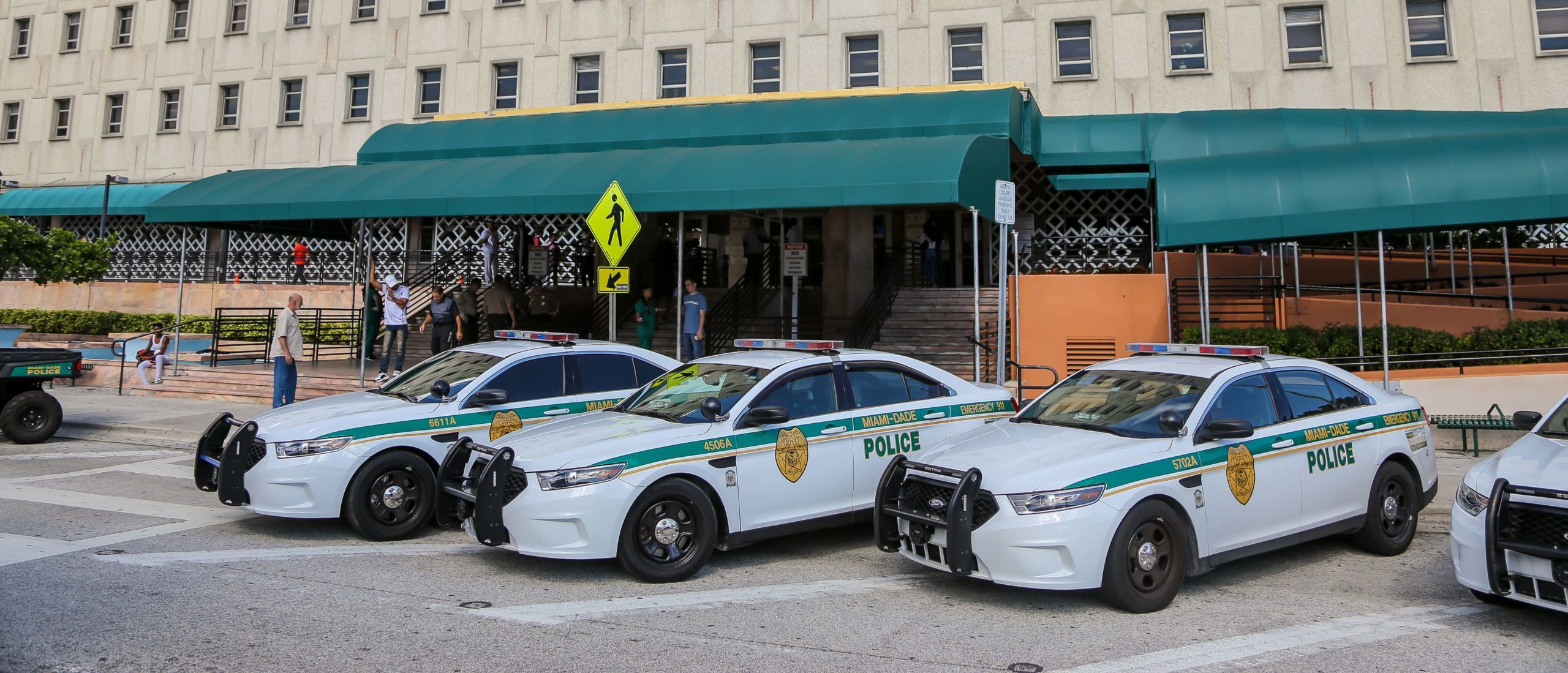 Former Catholic School Teacher Charged With 15 Child Sex Crimes Police cars are seen outside the Miami-Dade County courthouse in Miami, Florida on November 8, 2019. (Photo by Zak BENNETT / AFP) (Photo by ZAK BENNETT/AFP via Getty Images)