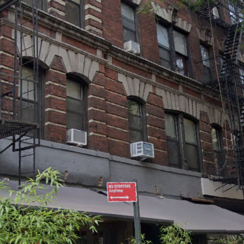 Firefighters climb three stories to save trapped kitten in nyc's west village - photo licensed by shore news network.