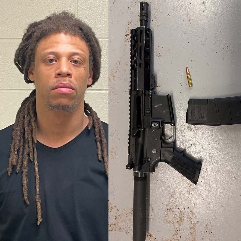 Man Charged after walking neighborhood with assault rifle