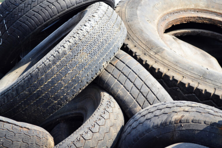 Illegal tire dumping suspect as akron officials deal with cleanup of over 4,000 tires citywide - photo licensed by shore news network.