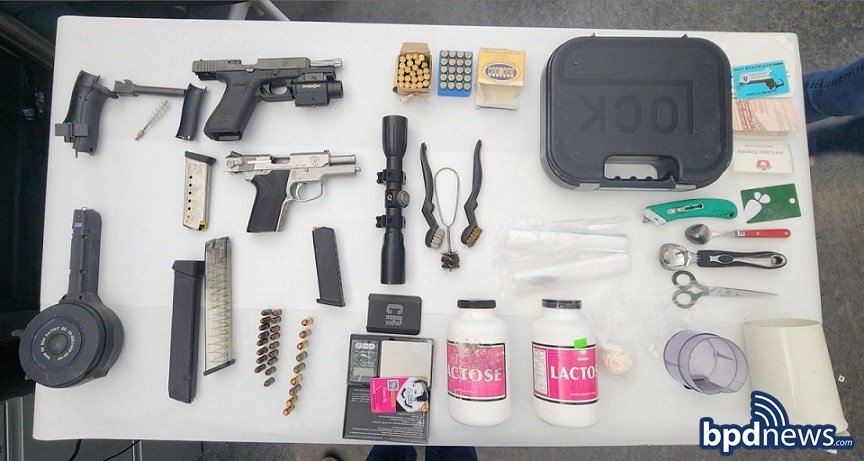 Guns, drugs seized in Roxbury bust