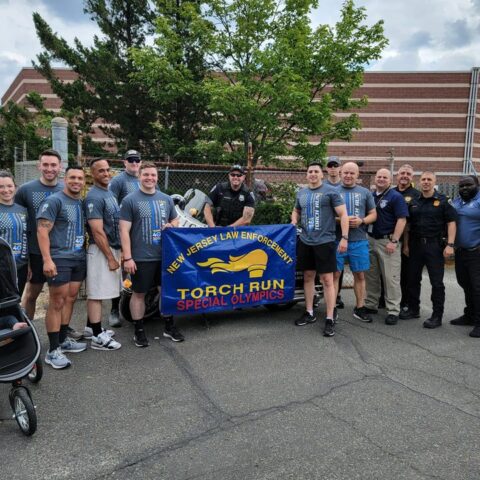 Wakefield police officer carry the torch for special olympics - photo licensed by shore news network.
