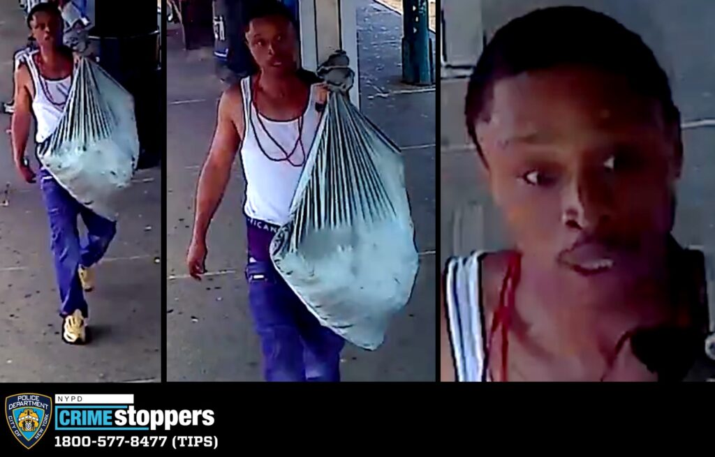 Armed Robber Forced Female Worker to Fill Green Sack with Merchandise Armed Robber Forced Female Worker to Fill Green Sack with Merchandise