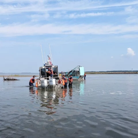 11 rescued by coast guard after boat capsizes in oregon inlet - photo licensed by shore news network.