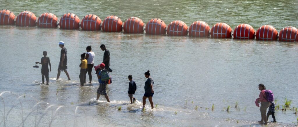Biden Admin Sues Texas Over Floating Border Barrier