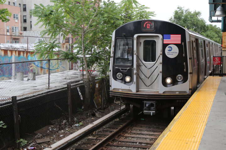 NYC Subway Q Train arriving at Kings Highway Station in Brooklyn