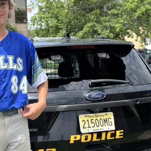 Teen smashes cop car window with grand slam, police ok with it - photo licensed by shore news network.