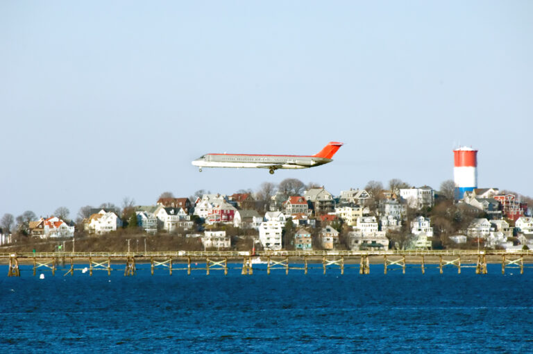 Large ice chunks fall from plane damaging mass. Home - photo licensed by shore news network.