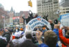Fans cheer at former New York Giants Legends durring the 2008 Superbowl victory parade in New York, February 5, 2008.