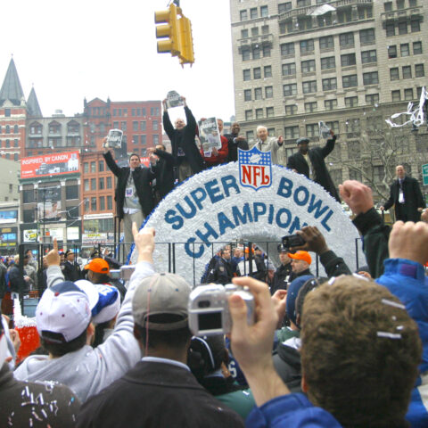 Fans cheer at former new york giants legends durring the 2008 superbowl victory parade in new york, february 5, 2008.
