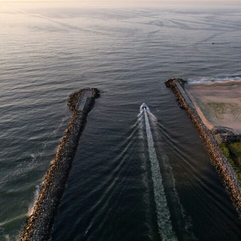 Two boaters rescued after crashing into rocks at manasquan inlet - photo licensed by shore news network.