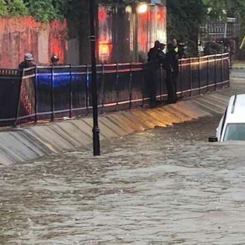 Perth amboy cops rescue woman and her dog in flood submerged car - photo licensed by shore news network.