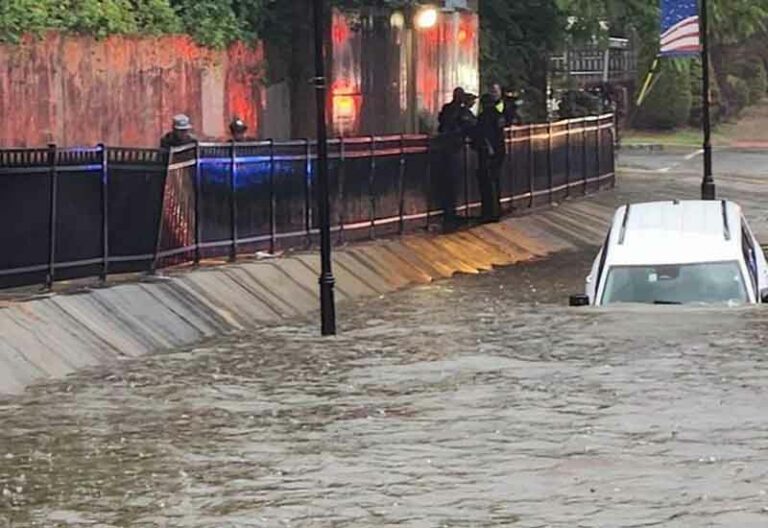 Perth amboy cops rescue woman and her dog in flood submerged car - photo licensed by shore news network.