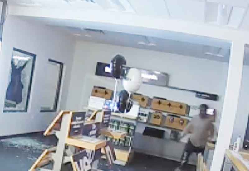 Police Seek Phone Store Smash and Grab Suspect
