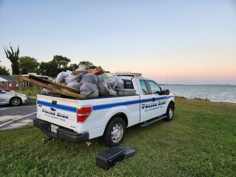 Newport police officers join beach cleanup with community volunteers - photo licensed by shore news network.