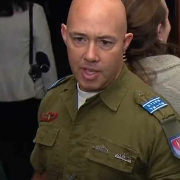 Tlaib has her flag, i have my uniform as congressman dons idf service top - photo licensed by shore news network.