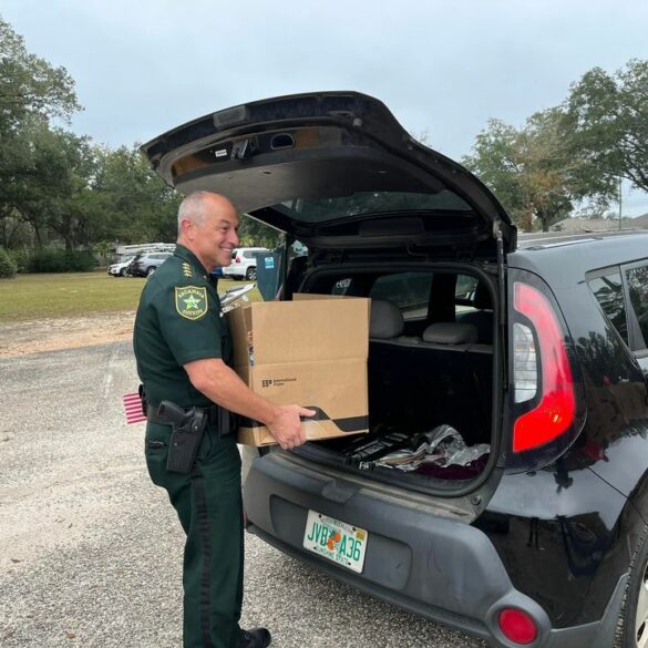 Escambia county sheriff's office distributes 30,000 pounds of thanksgiving meals - photo licensed by shore news network.