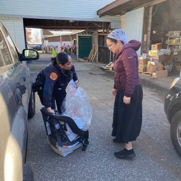 Suffolk police and partners provide car seats, coats, and food to families in mastic - photo licensed by shore news network.