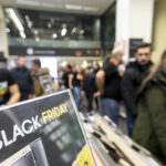 People shop inside a department store during Black Friday shopping deals