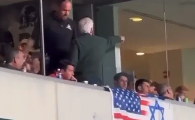 New jersey governor chris christie sits and eats while his pal, democrat party boss george norcross ejected at eagles game.