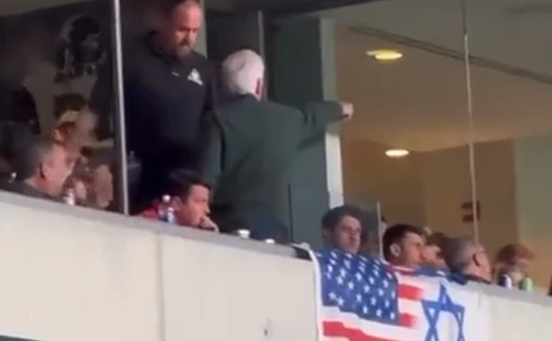 New Jersey Governor Chris Christie sits and eats while his pal, Democrat Party Boss George Norcross ejected at Eagles game.