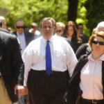 Christie, center walks down High Street in Burlington City. Photo by Scott Anderson.