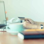 Cyber-Monday-sale-tag-banner-with-woman-holding-credit-card-use-laptop-computer-to-shopping-online-at-cafe