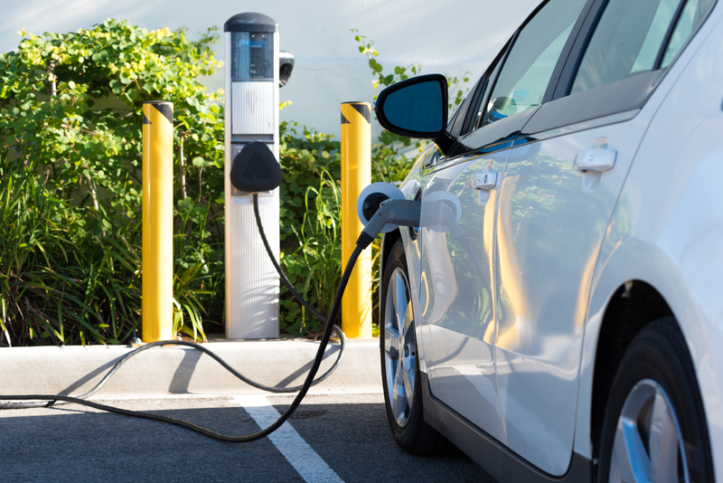 Electric Car Charging at Charging Station - File Photo