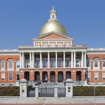 Front view of Capitol Building, Boston, Massachusetts, against a blue sky