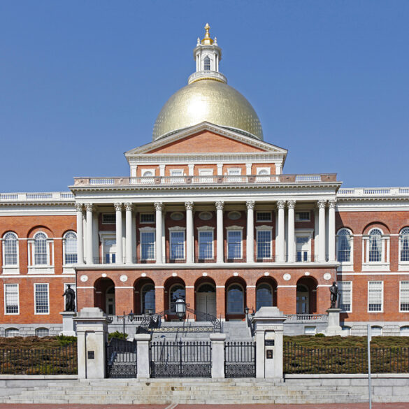 Front view of capitol building, boston, massachusetts, against a blue sky
