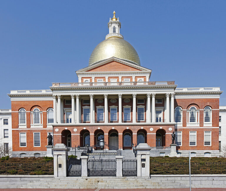 Front view of capitol building, boston, massachusetts, against a blue sky