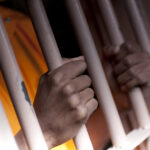 Man inside jail cell - File Photo