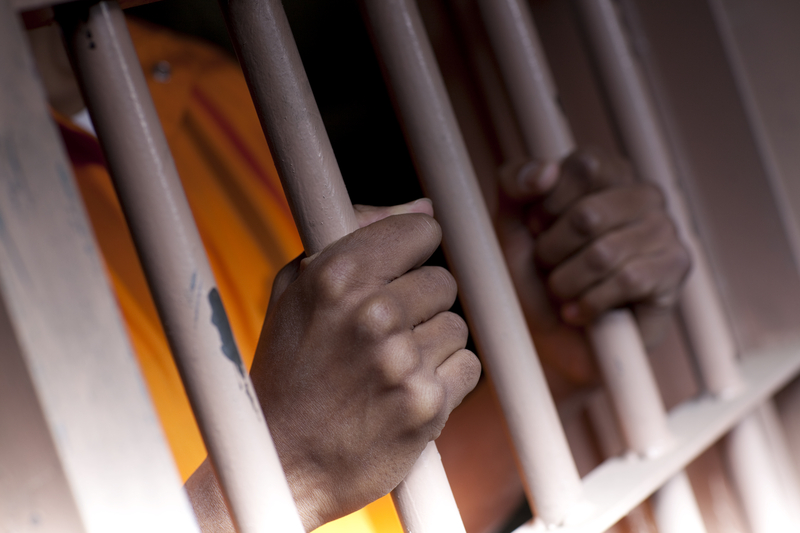 Man inside jail cell - File Photo