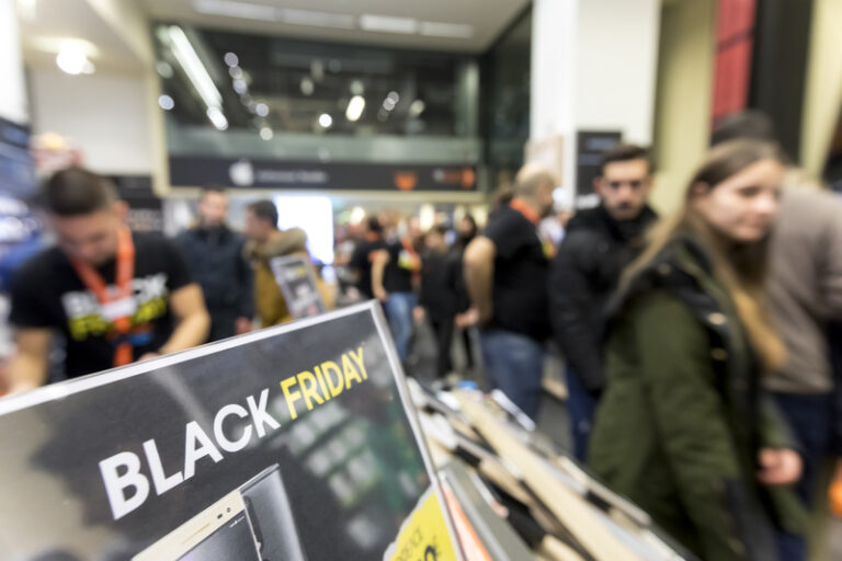 People shop inside a department store during black friday shopping deals