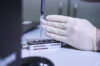 Testing a laboratory sample.