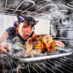 A woman burning her Thanksgiving dinner.