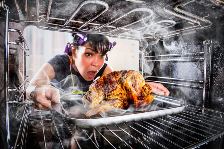 A woman burning her thanksgiving dinner.
