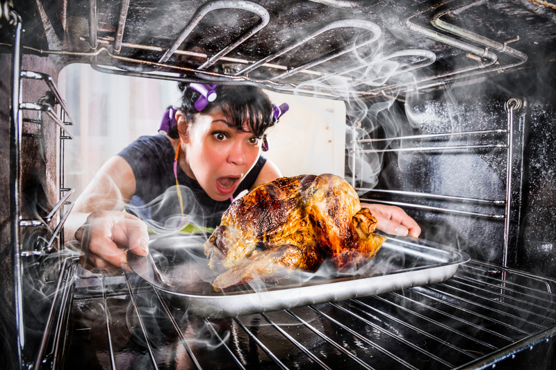 A woman burning her Thanksgiving dinner.