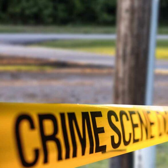 A telephone police behind a police crime scene line - file photo