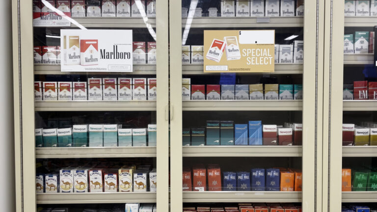 Cigarette display in grocery store.