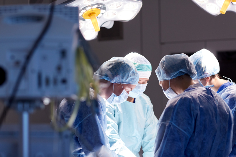 surgeons in operating room at hospital © Syda Productions | Dreamstime.com