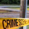 A telephone police behind a police crime scene line - File Photo