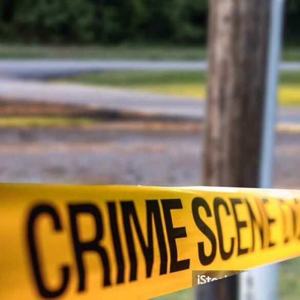 A telephone police behind a police crime scene line - file photo