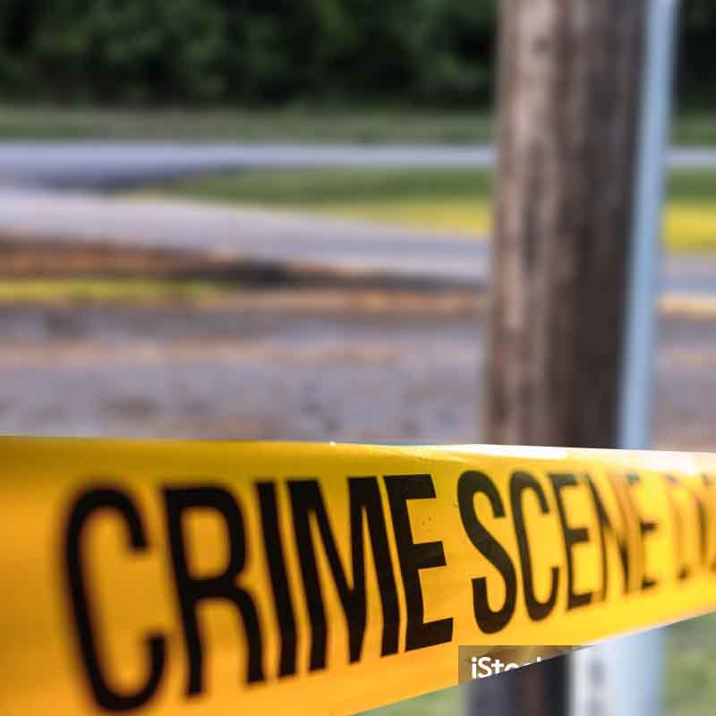 A telephone police behind a police crime scene line - File Photo
